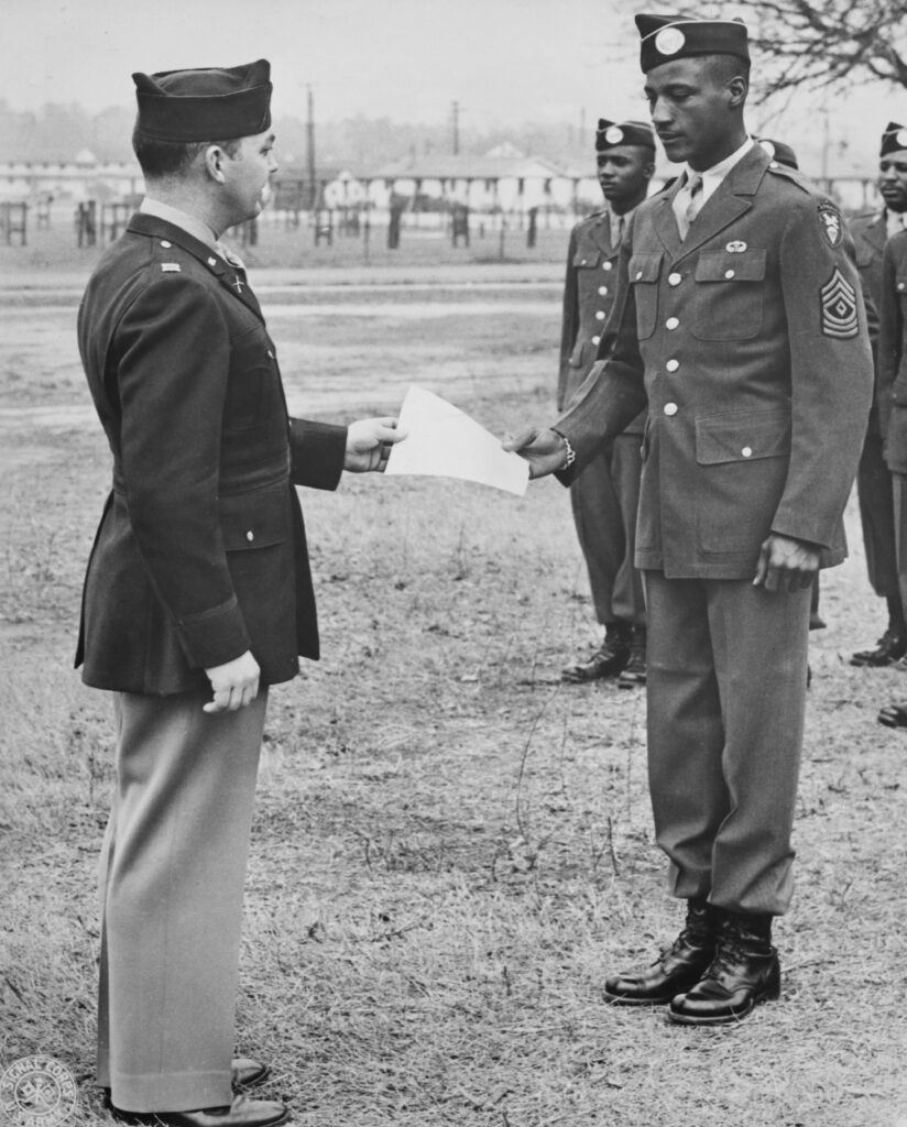 First Sergeant Walter Morris of the United States Army 555th Parachute Infantry Battalion is presented with his paratrooper graduation certificate on 18th February 1944 at Fort Benning, Georgia, United States.