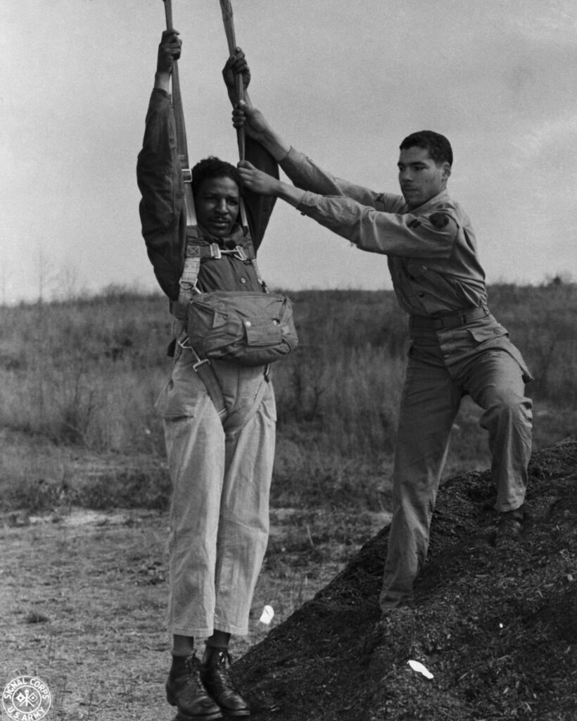 Corporal Elijah H Wesby of Philadelphia and Sergeant Roger S Walden of Detroit during jump training with the United States Army All African American 555th Parachute Infantry Battalion