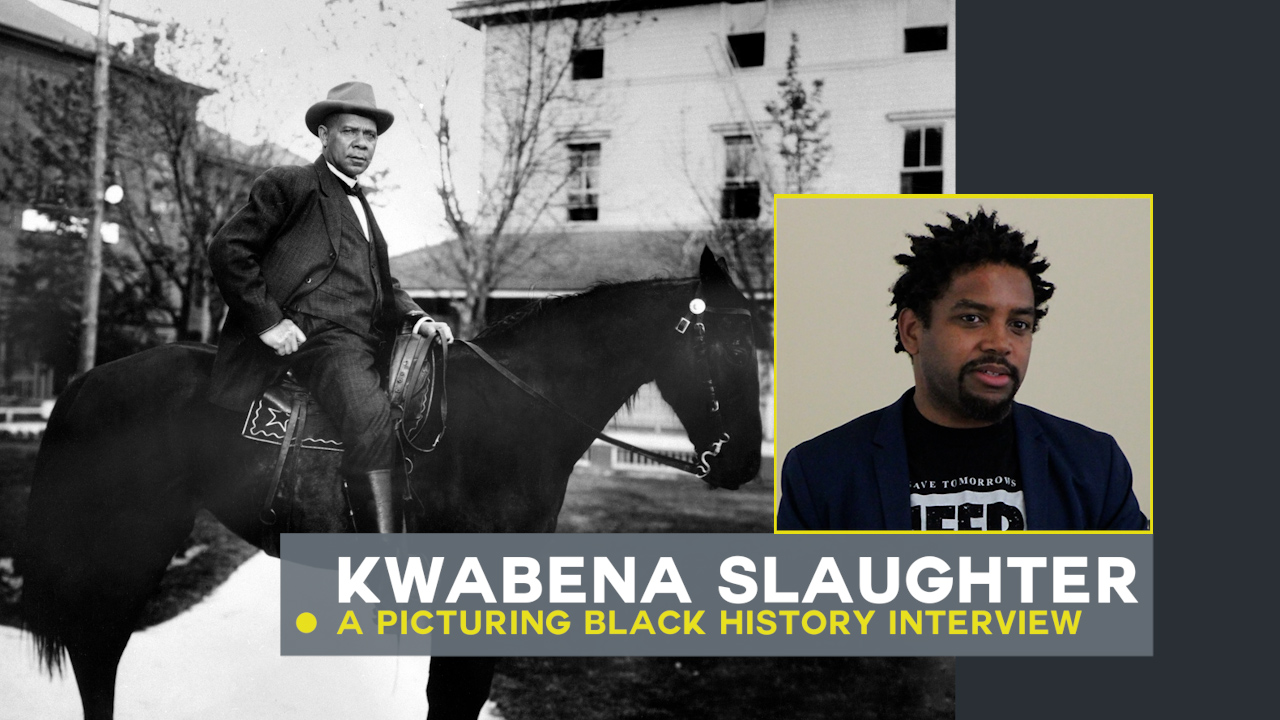 Kwabena Slaugher and image of Booker Washington in background