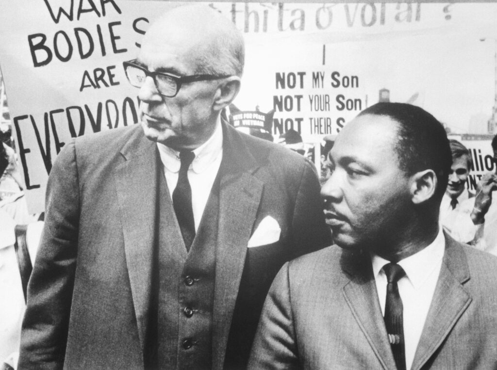 In 1967, Dr. Benjamin Spock (L) and Rev. Dr. Martin Luther King Jr. lead nearly 5,000 marchers through the Chicago Loop in protest of the US policy in Vietnam.