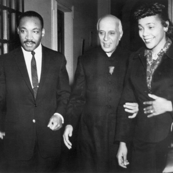 In 1959, Indian Prime Minister Jawaharlal Nehru (C) is flanked by his guests, American civil rights leader Dr. Martin Luther King (L) and wife Coretta Scott King during a one-month visit to India at the invitation of the Gandhi Peace Foundation.