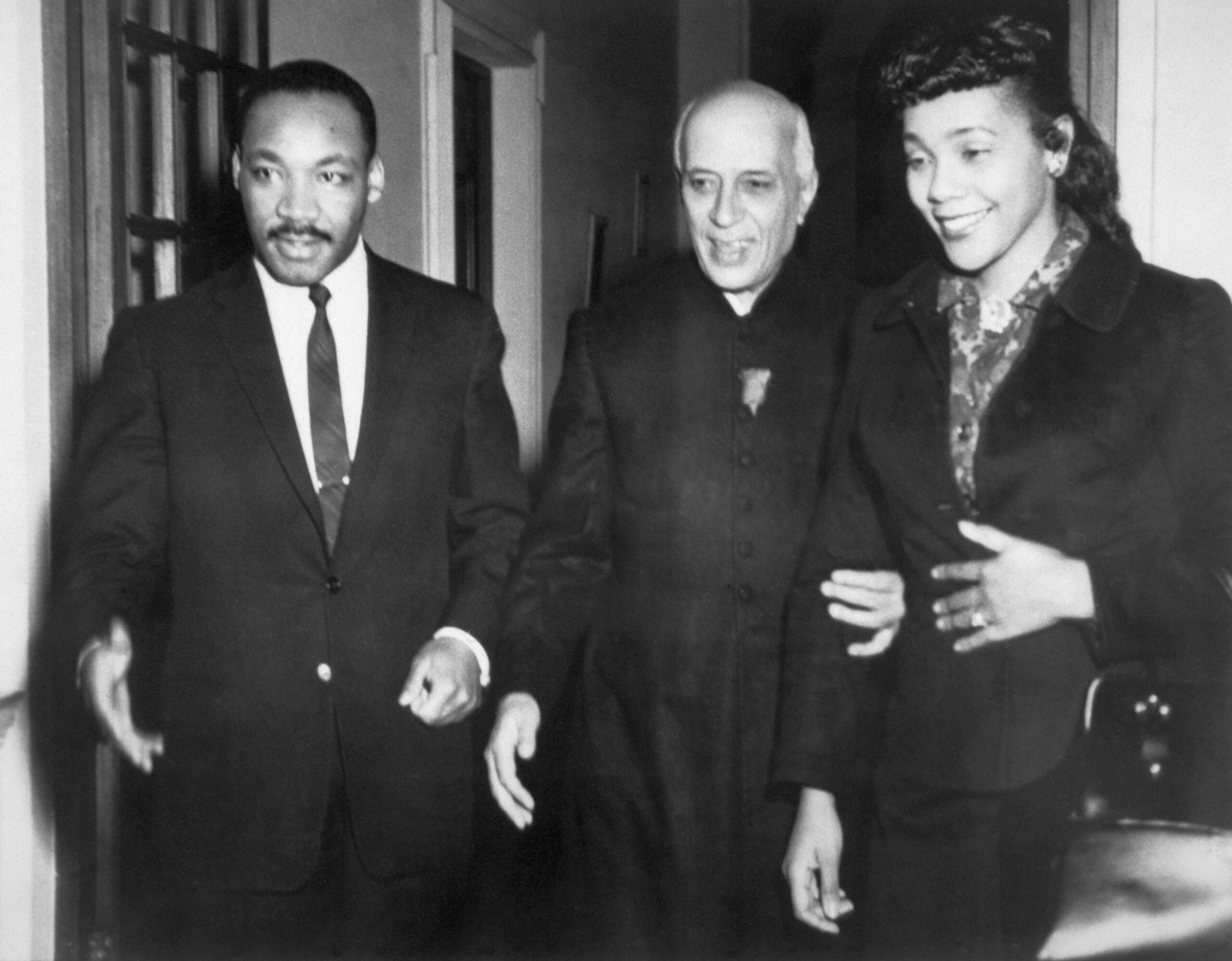 In 1959, Indian Prime Minister Jawaharlal Nehru (C) is flanked by his guests, American civil rights leader Dr. Martin Luther King (L) and wife Coretta Scott King during a one-month visit to India at the invitation of the Gandhi Peace Foundation.