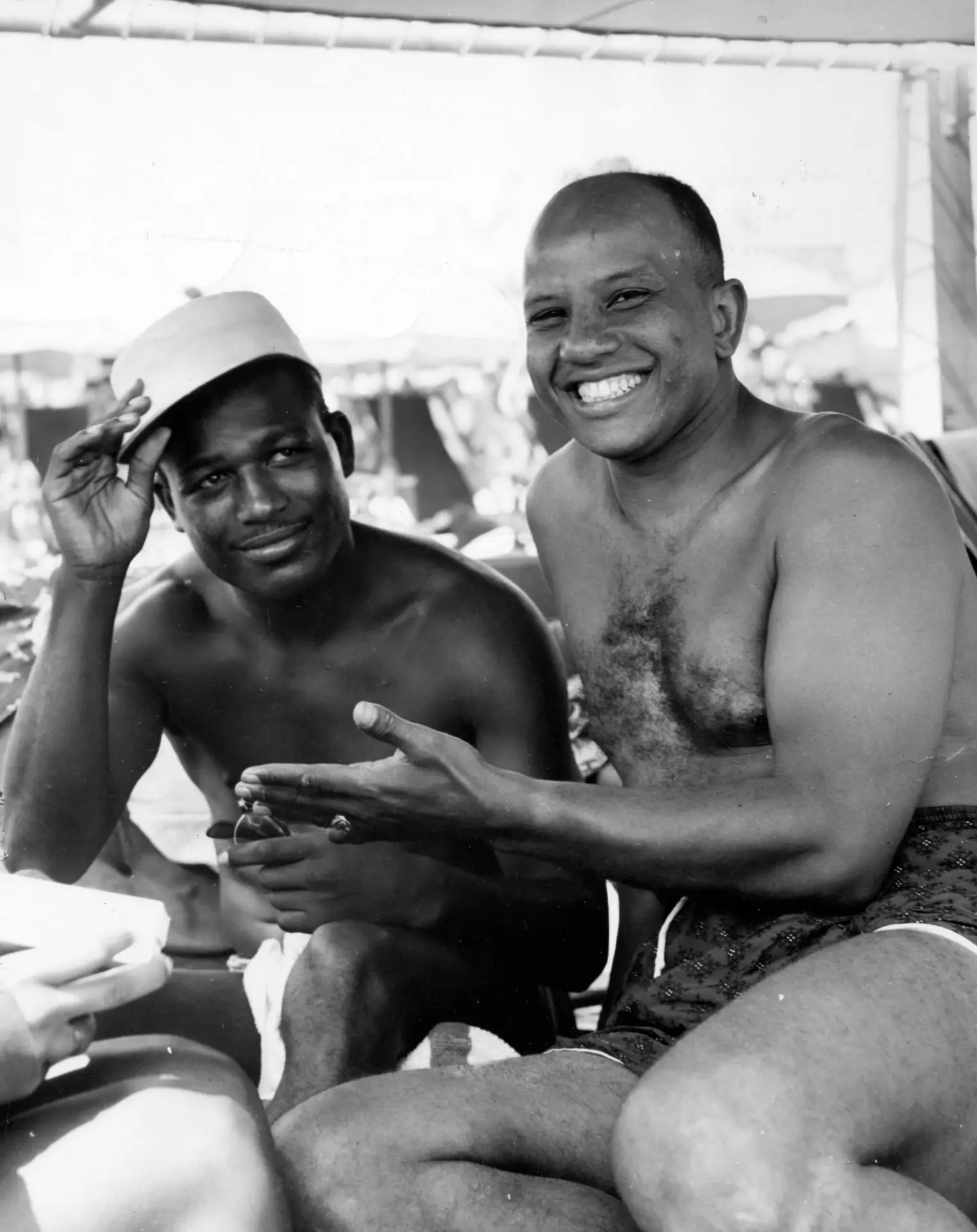 Hal Jackson, disc jockey on Radio Station WOST, on a beach in Atlantic City with Sugar Ray Robinson, Worlds Middleweight Boxing Champion, Atlantic City, New Jersey, 1955.