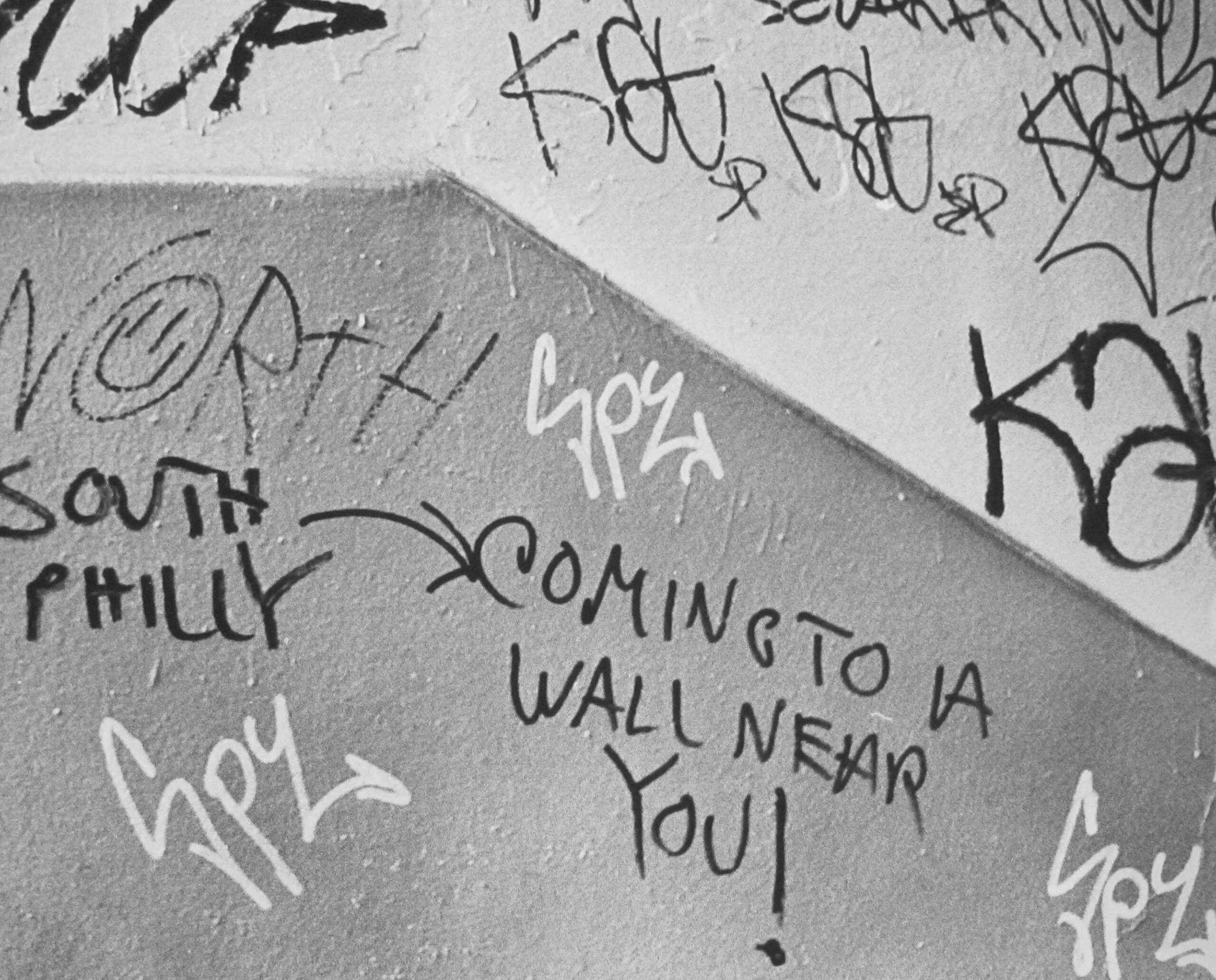 Graffiti on a subway wall in Center City, Philadelphia, Pennsylvania, 1975. One reads 'South Philly - Coming To A Wall Near You!'