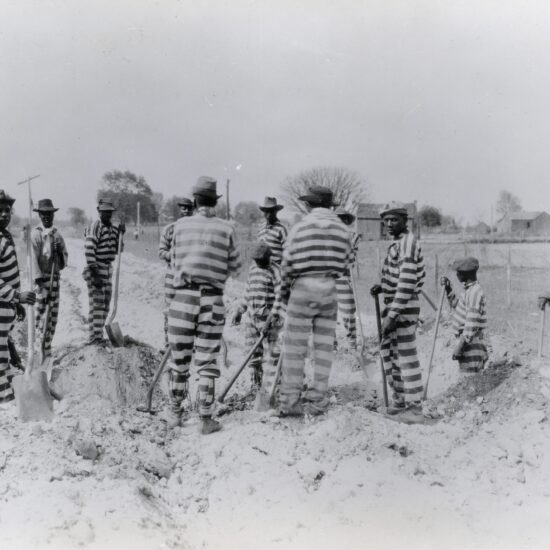 Florida-Prisoners in a chain gang building a road. Undated photograph.