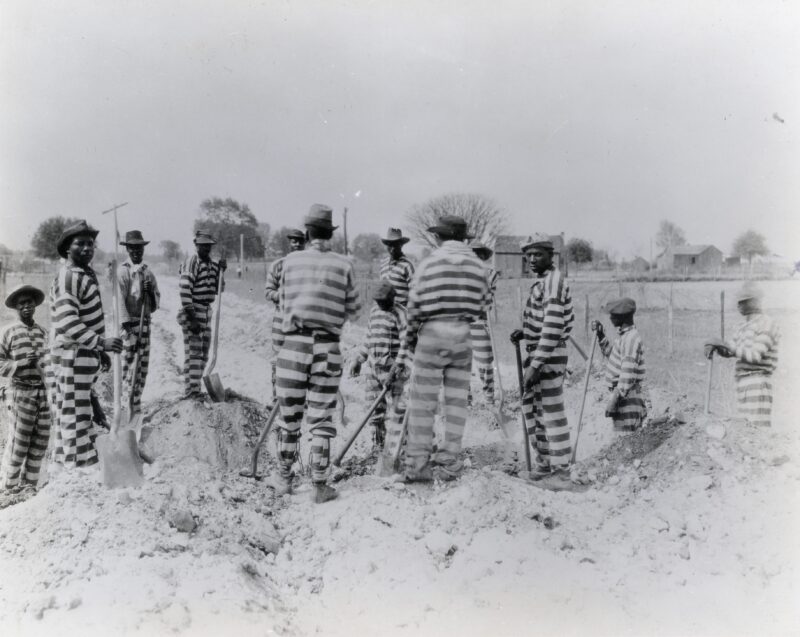 Florida-Prisoners in a chain gang building a road. Undated photograph.