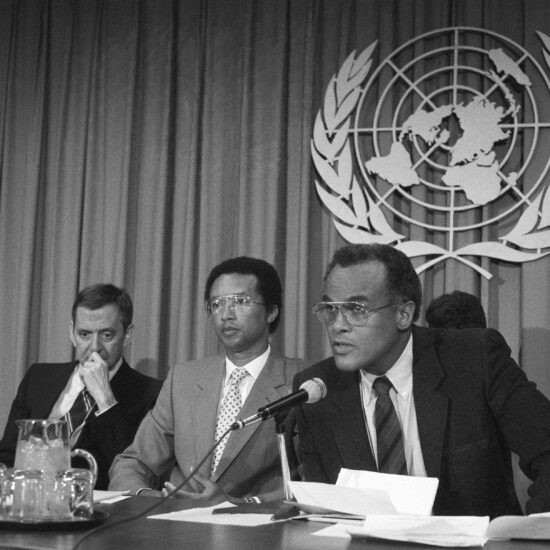 Singer and actor Harry Belafonte speaks at a news conference at the United Nations Headquarters to announce the formation of Artists and Athletes Against Apartheid. At left are actors Gregory Hines and Tony Randall and tennis notable Arthur Ashe.