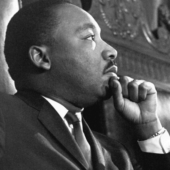 Reverend Martin Luther King Jr. waits to address the combined session of the Massachusetts State Legislature at the Massachusetts State House in Boston on April 23, 1965.