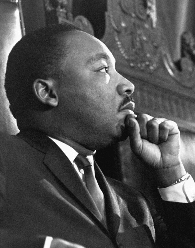 Reverend Martin Luther King Jr. waits to address the combined session of the Massachusetts State Legislature at the Massachusetts State House in Boston on April 23, 1965.
