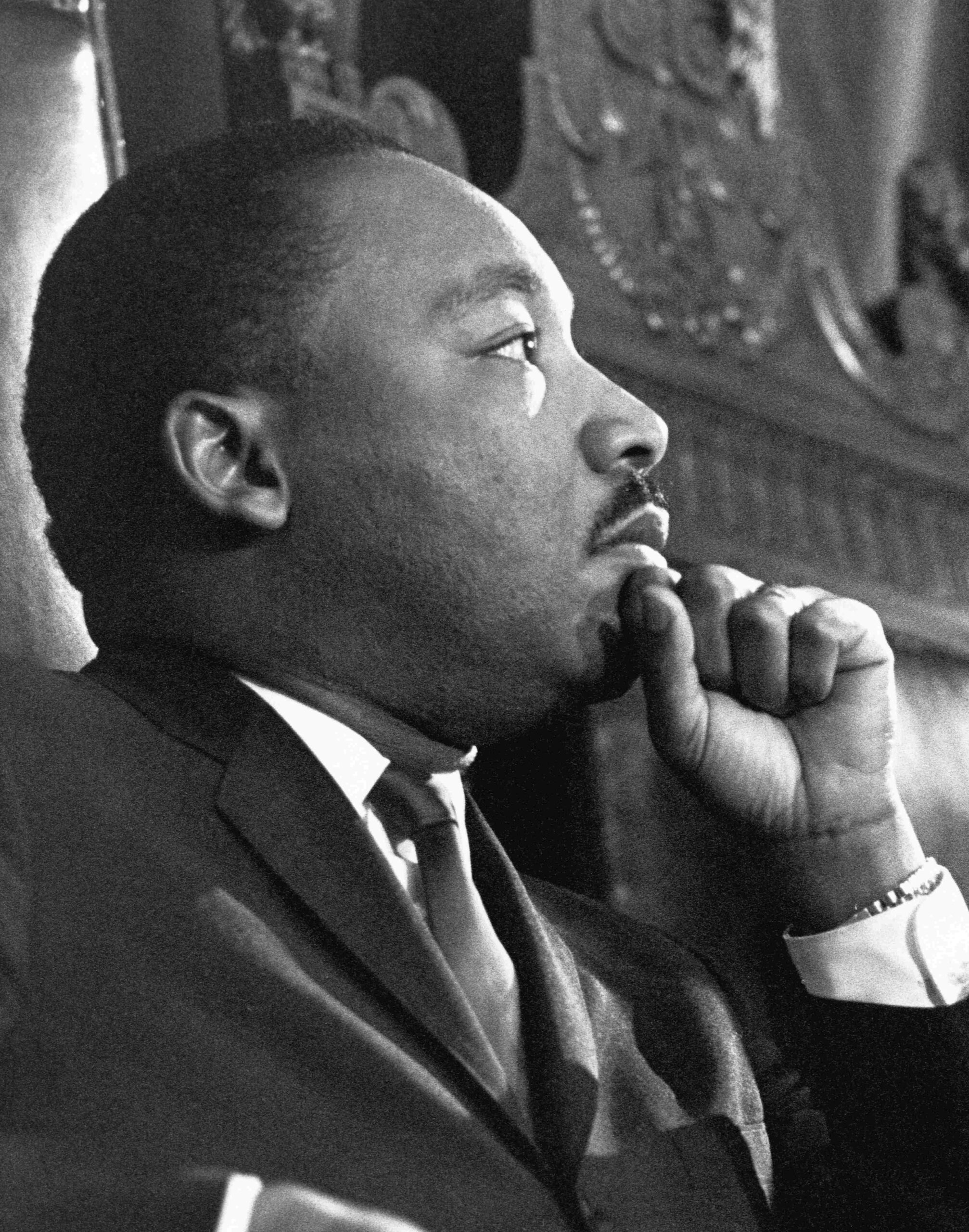 Reverend Martin Luther King Jr. waits to address the combined session of the Massachusetts State Legislature at the Massachusetts State House in Boston on April 23, 1965.